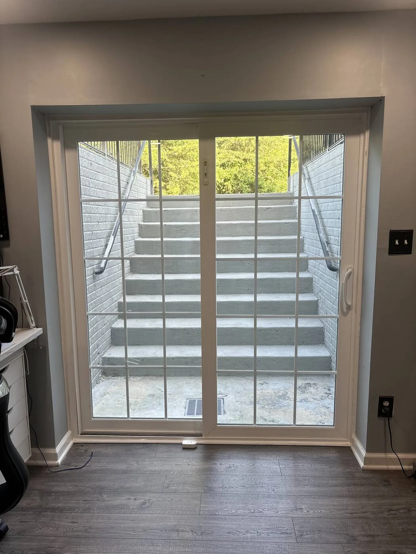 A new sliding door seen from inside, looking out to steps