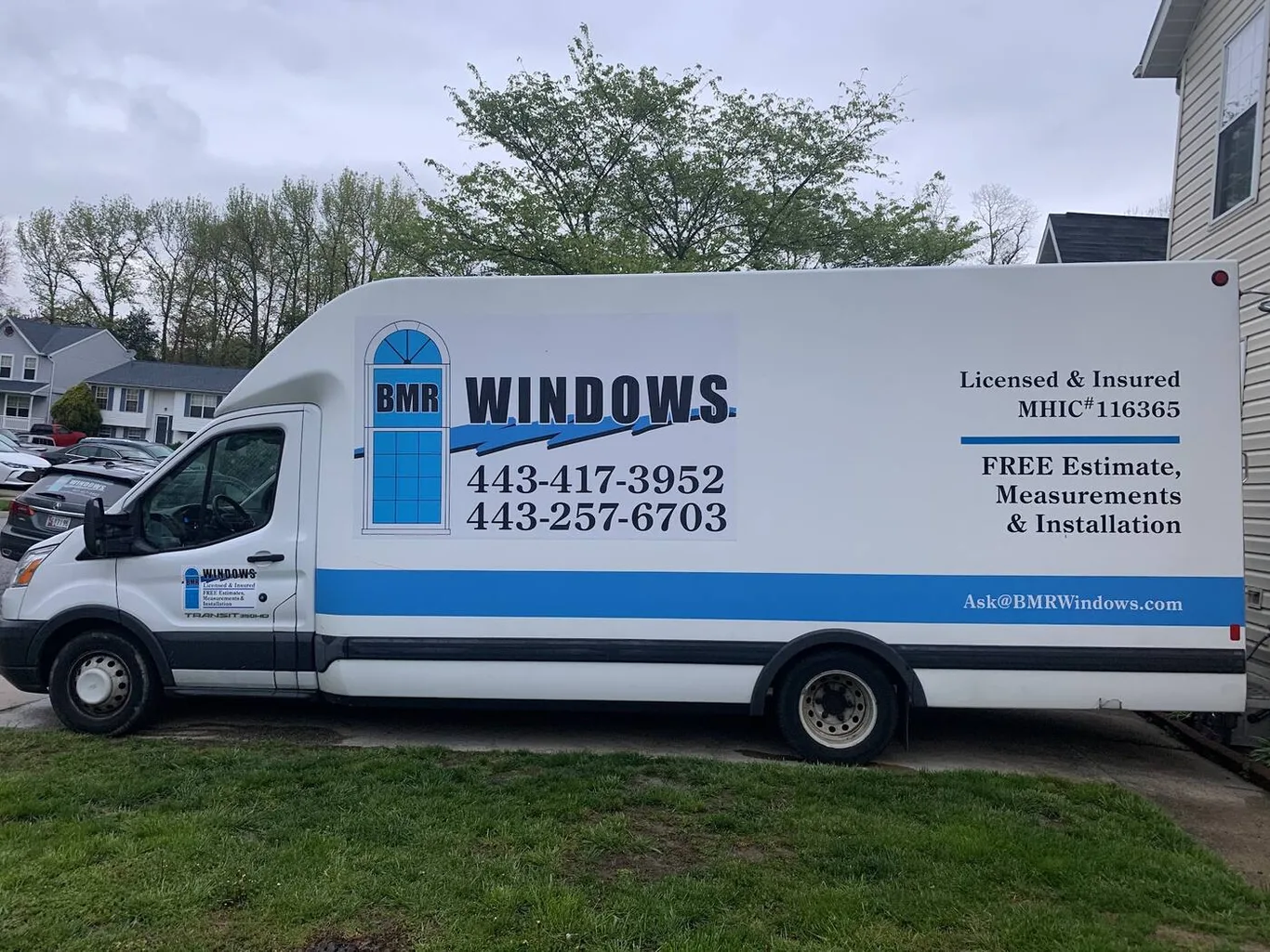 BMR's white box van, lettered with the BMR Windows logo, both phone numbers and MHIC 116365